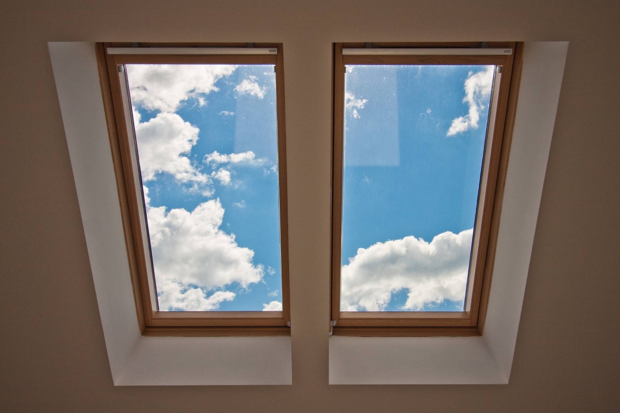 Partly cloudy sky through a home's skylight near Arlington Heights, Illinois (IL)